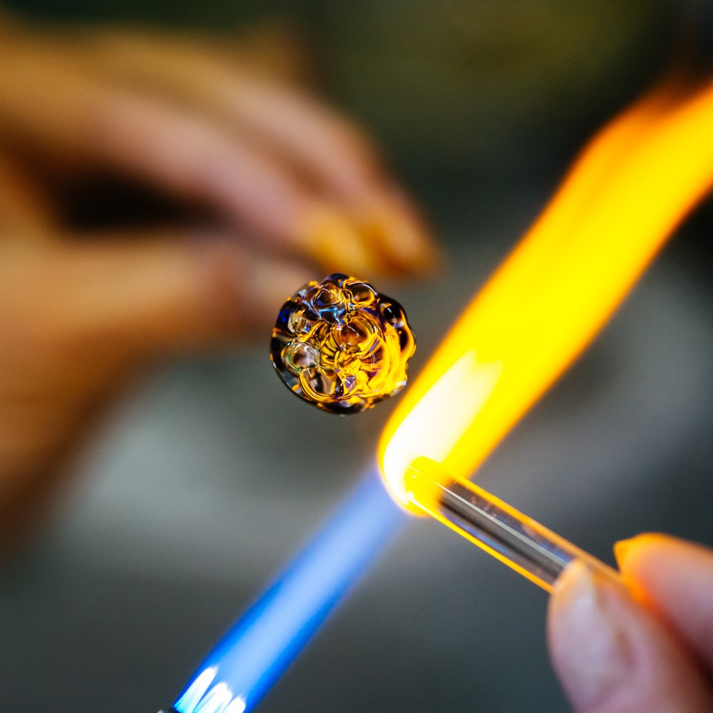 Glass rod meeting the torch flame